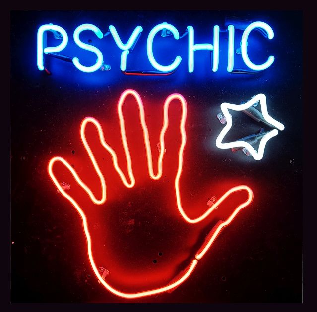Psychic with hand